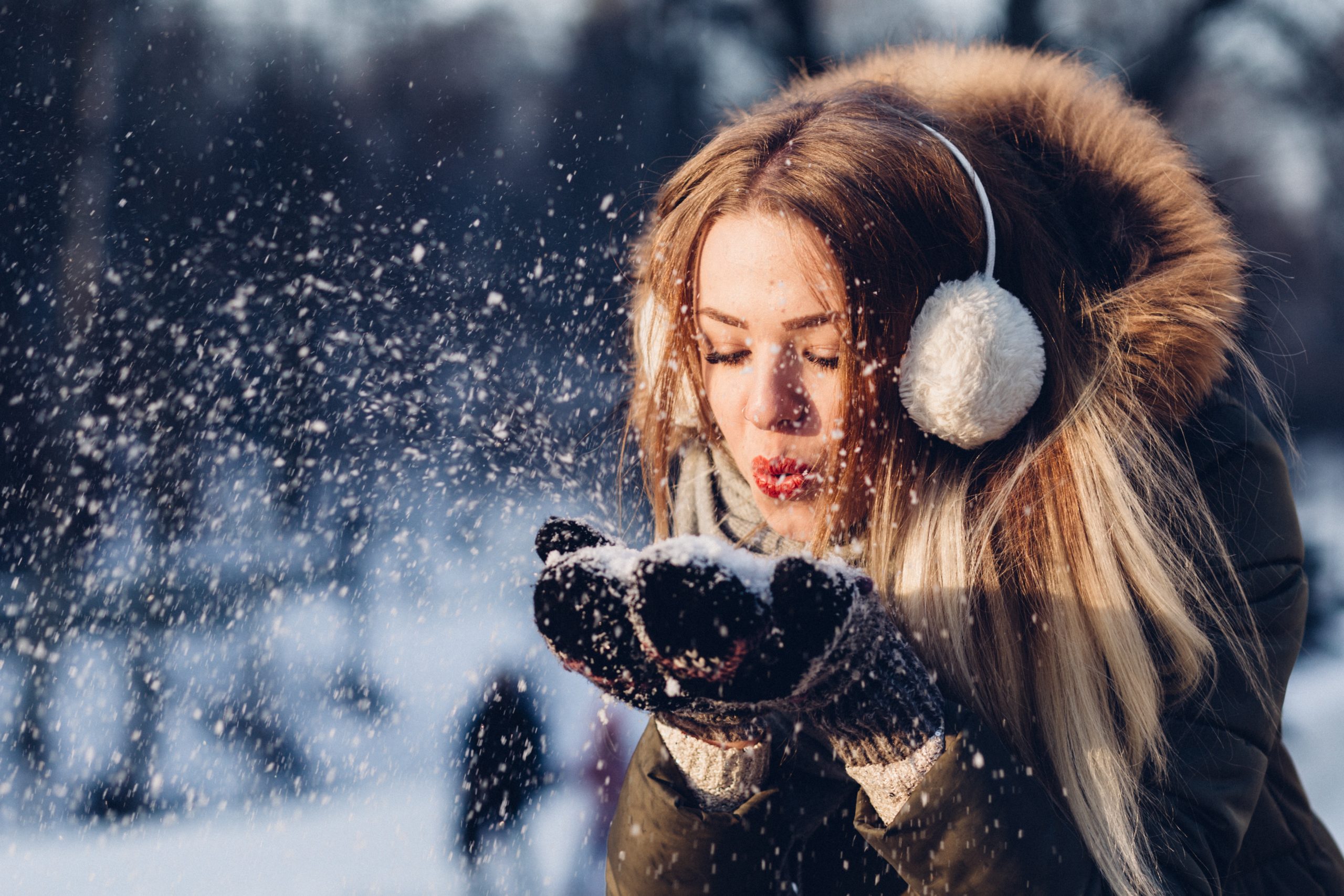 woman playing with snow